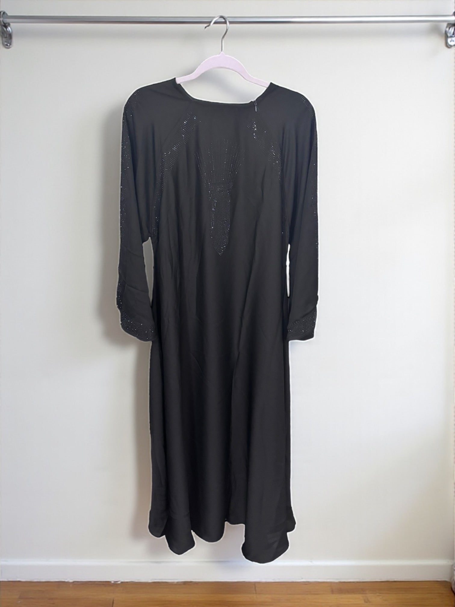 Women’s black Abaya Burqa by Saree Ghor Charlotte, modest Islamic dress with flowing fabric and elegant design.