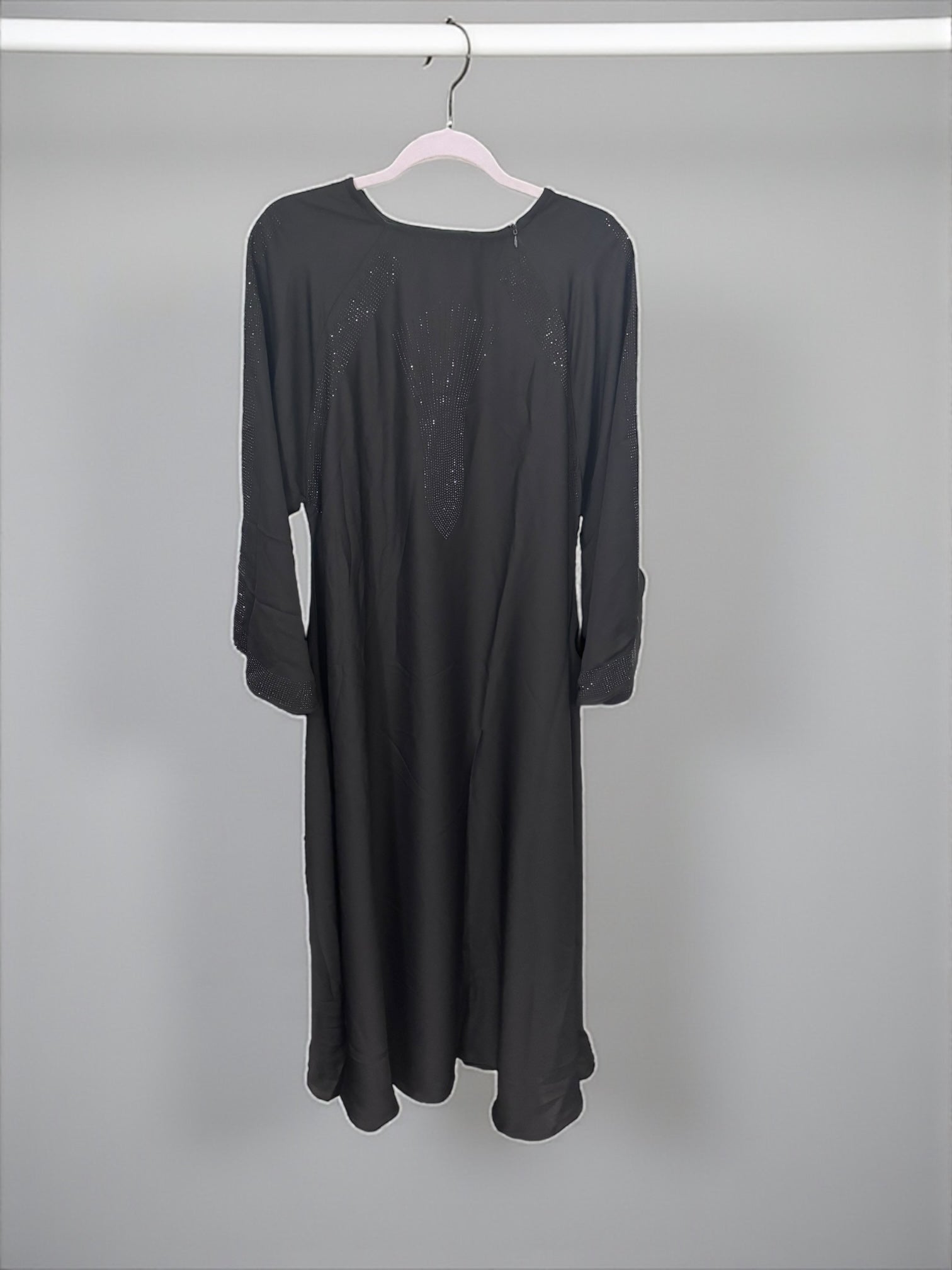 Women’s black abaya and burqa by Saree Ghor Charlotte, modest Islamic dress with flowing fabric and elegant design.
