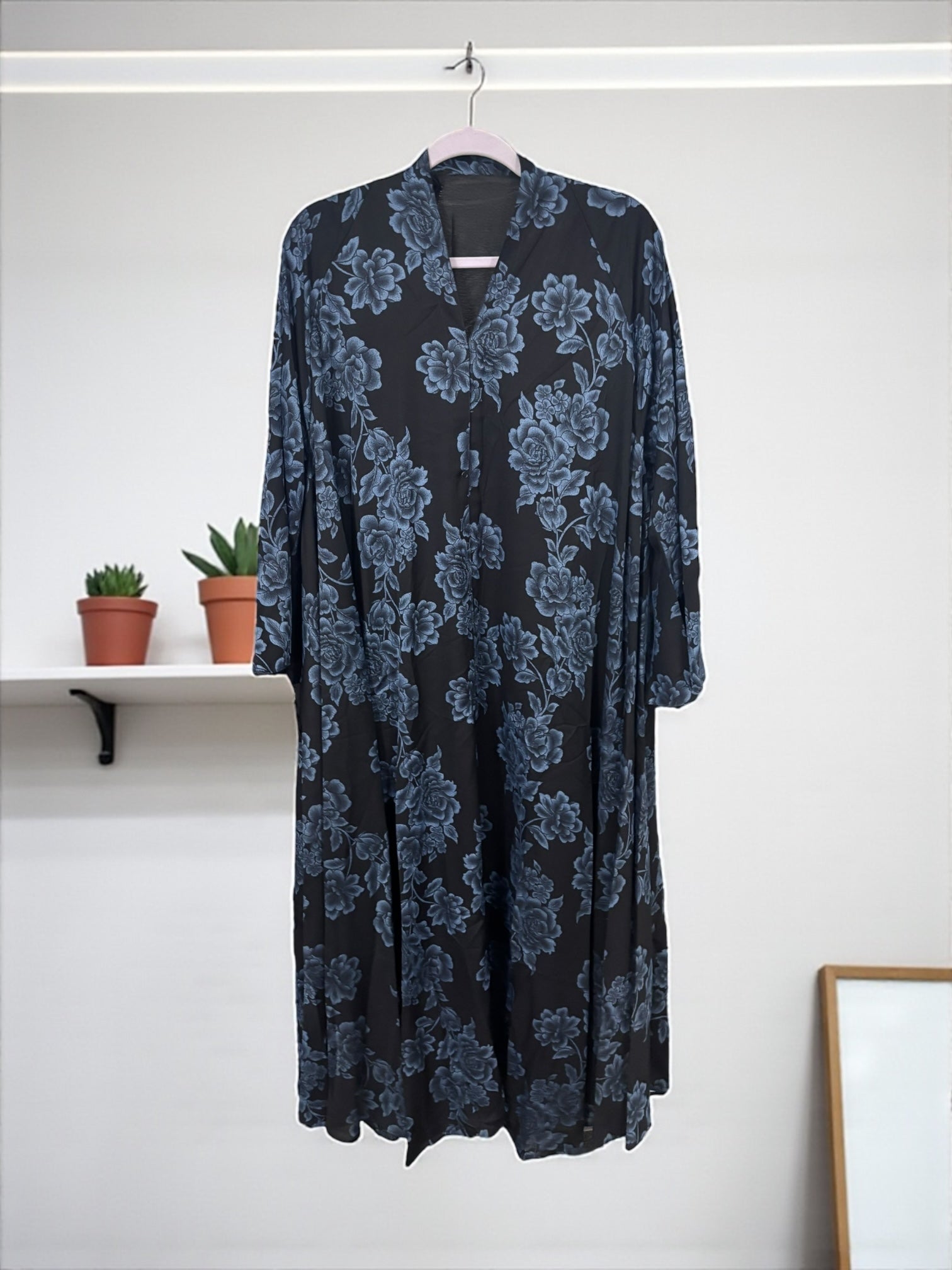 Women’s black Abaya burqa by Saree Ghor Charlotte, modest Islamic dress with flowing fabric and elegant design, front view.