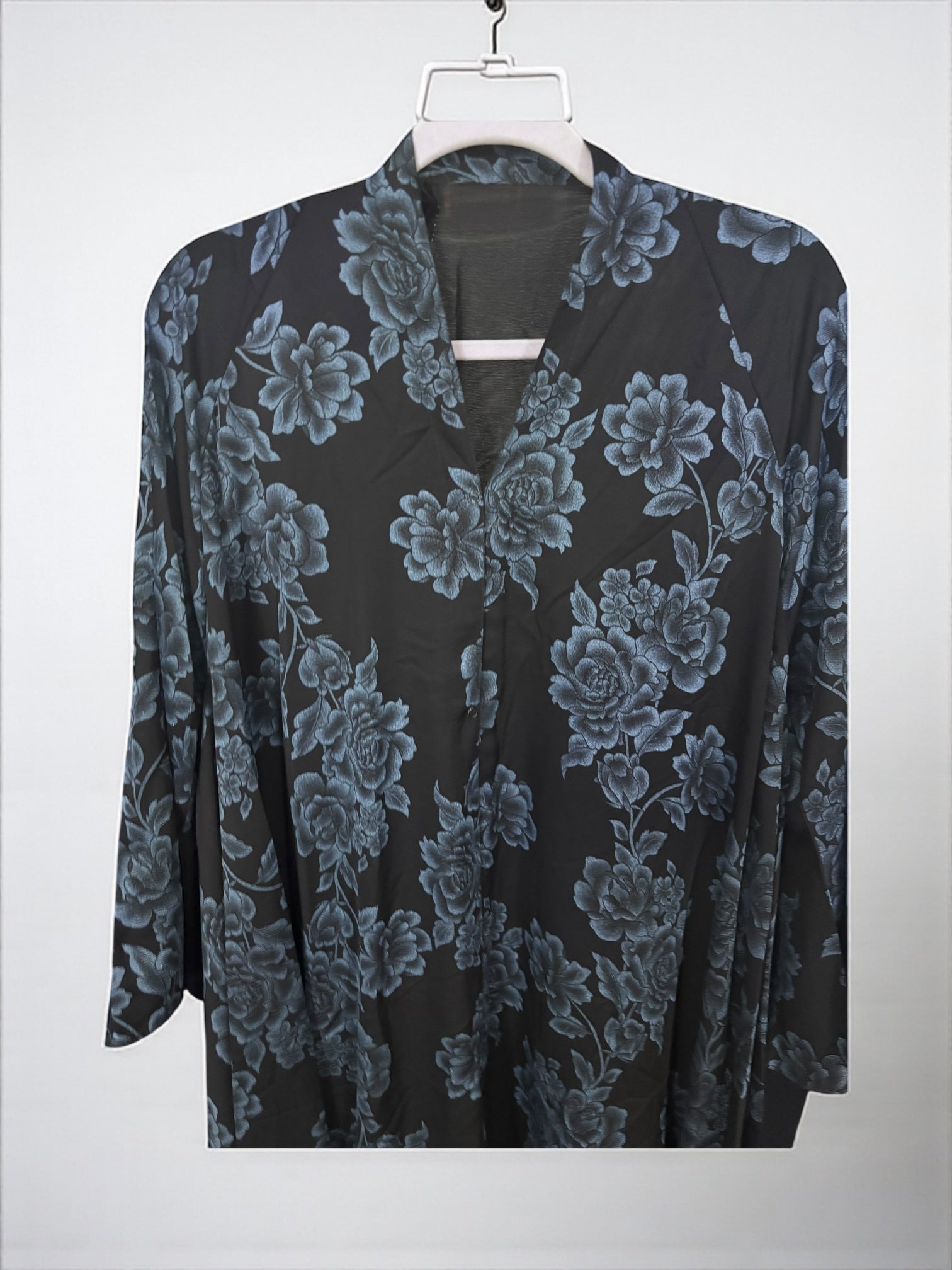Women’s black Abaya Burqa by Saree Ghor Charlotte, modest Islamic dress with flowing fabric and elegant design.