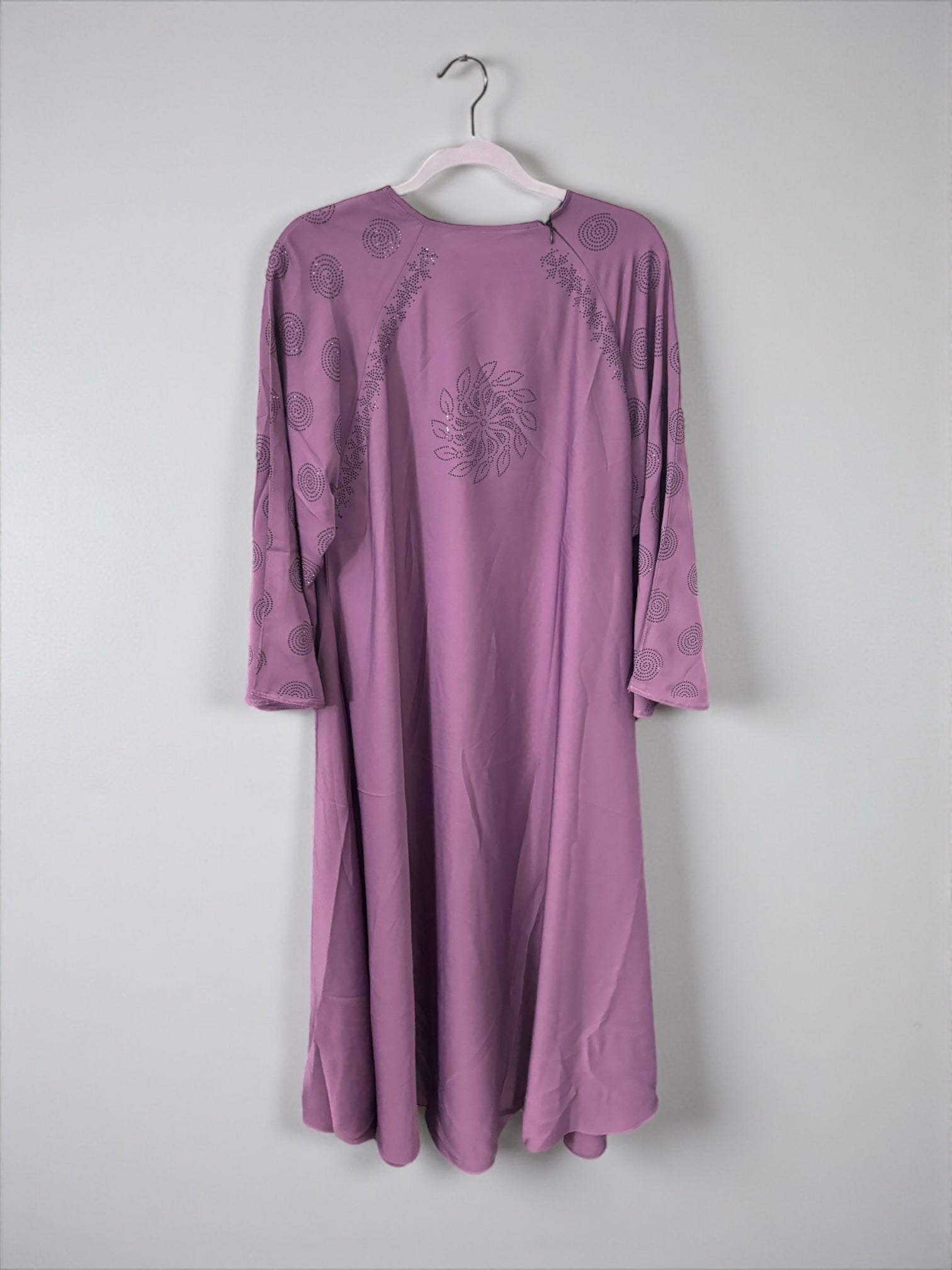 Women’s black Abaya burqa by Saree Ghor Charlotte, modest Islamic dress with flowing fabric and full-body coverage.