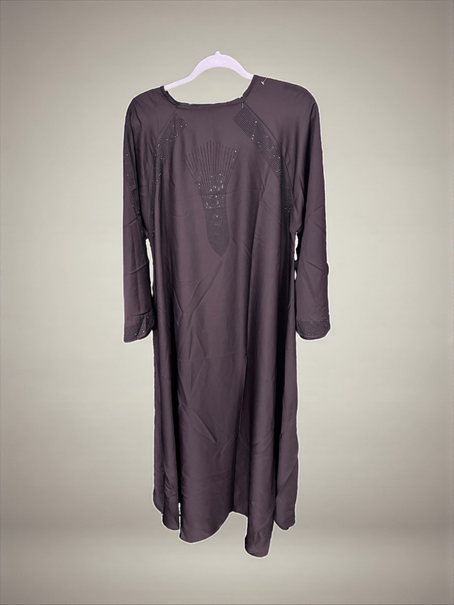 Women’s black Abaya burqa by Saree Ghor Charlotte, modest Islamic dress with flowing fabric and intricate embroidery details.