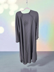 Women’s black abaya and burqa, modest Islamic dress by Saree Ghor Charlotte, featuring flowing fabric and full coverage.