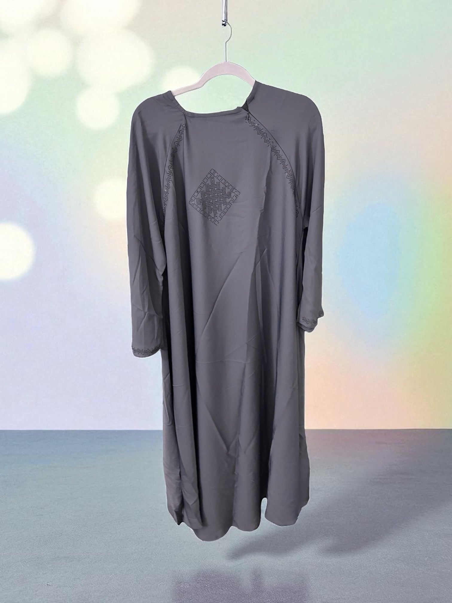 Women’s black abaya and burqa, modest Islamic dress by Saree Ghor Charlotte, featuring flowing fabric and full coverage.