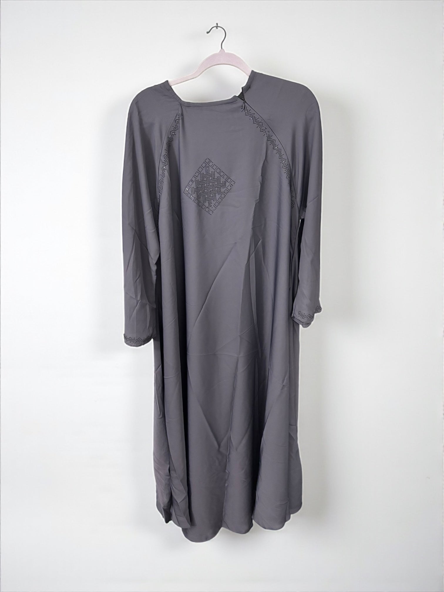 Women’s black abaya burqa by Saree Ghor Charlotte, modest Islamic dress with flowing fabric and full-length coverage.
