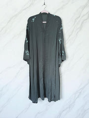 Women’s black Abaya Burqa by Saree Ghor Charlotte, modest Islamic dress with flowing fabric and elegant design, front view.