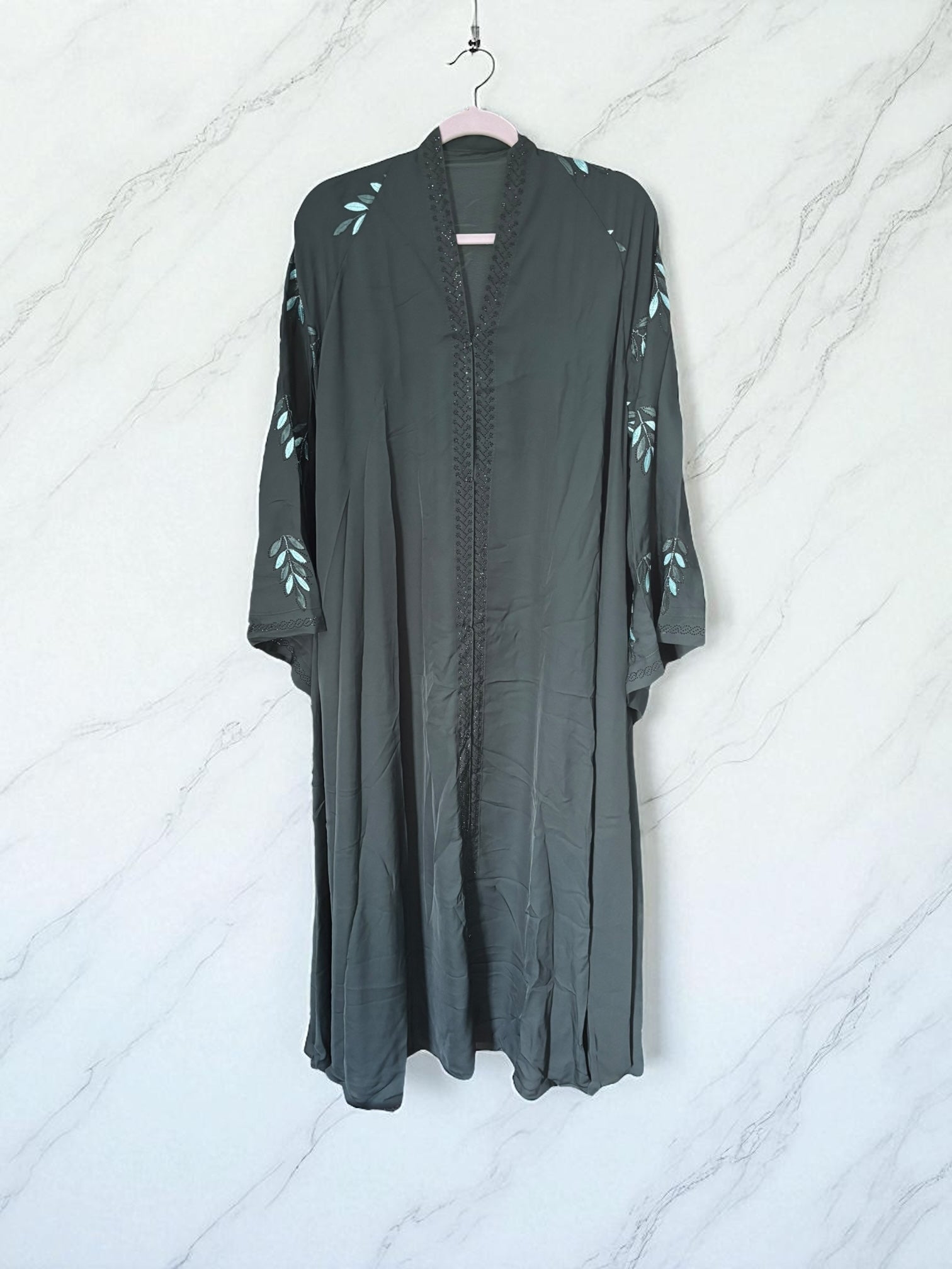 Women’s black Abaya Burqa by Saree Ghor Charlotte, modest Islamic dress with flowing fabric and elegant design, front view.