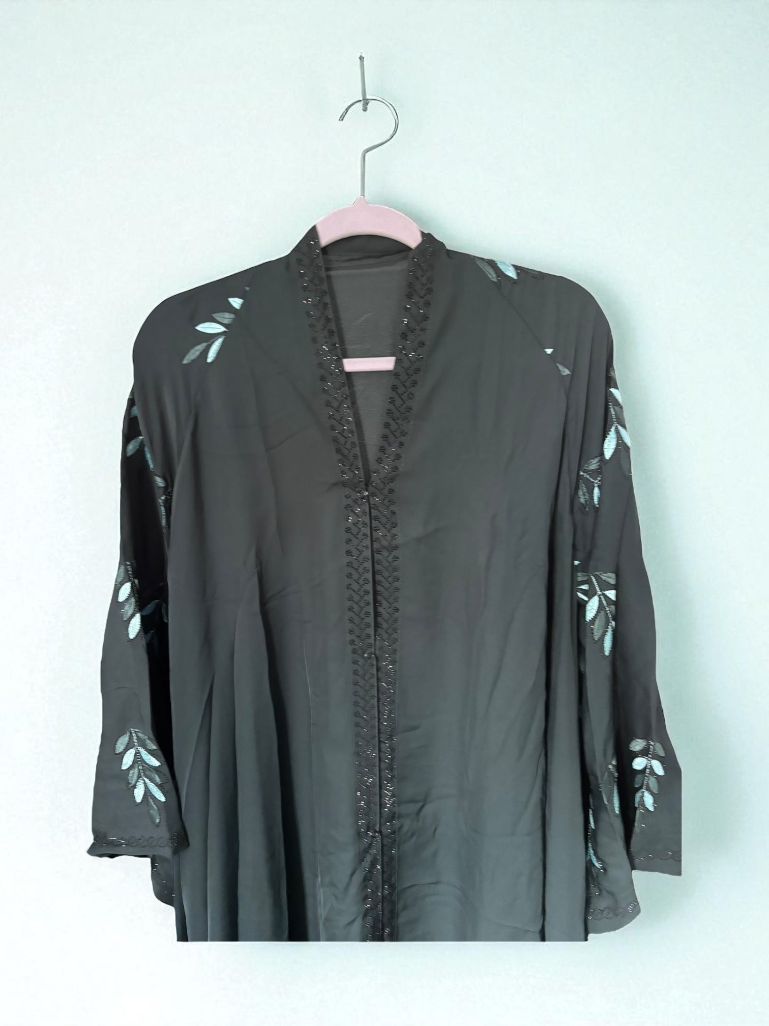 Women’s black Abaya Burqa by Saree Ghor Charlotte, modest Islamic dress with flowing fabric and full-length coverage.