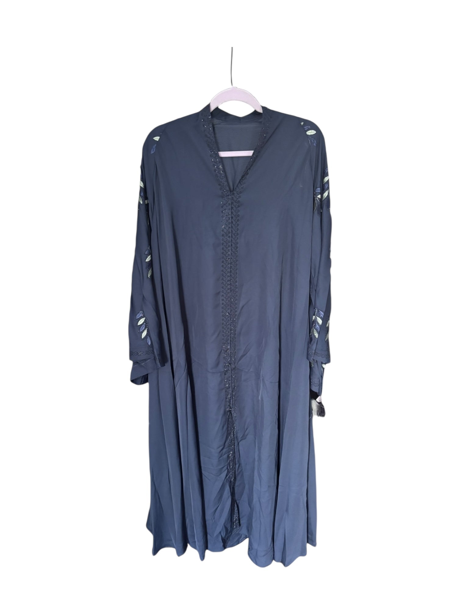 Women’s blue abaya burqa by Saree Ghor Charlotte, modest Islamic dress with flowing fabric and intricate details, suitable for religious wear.