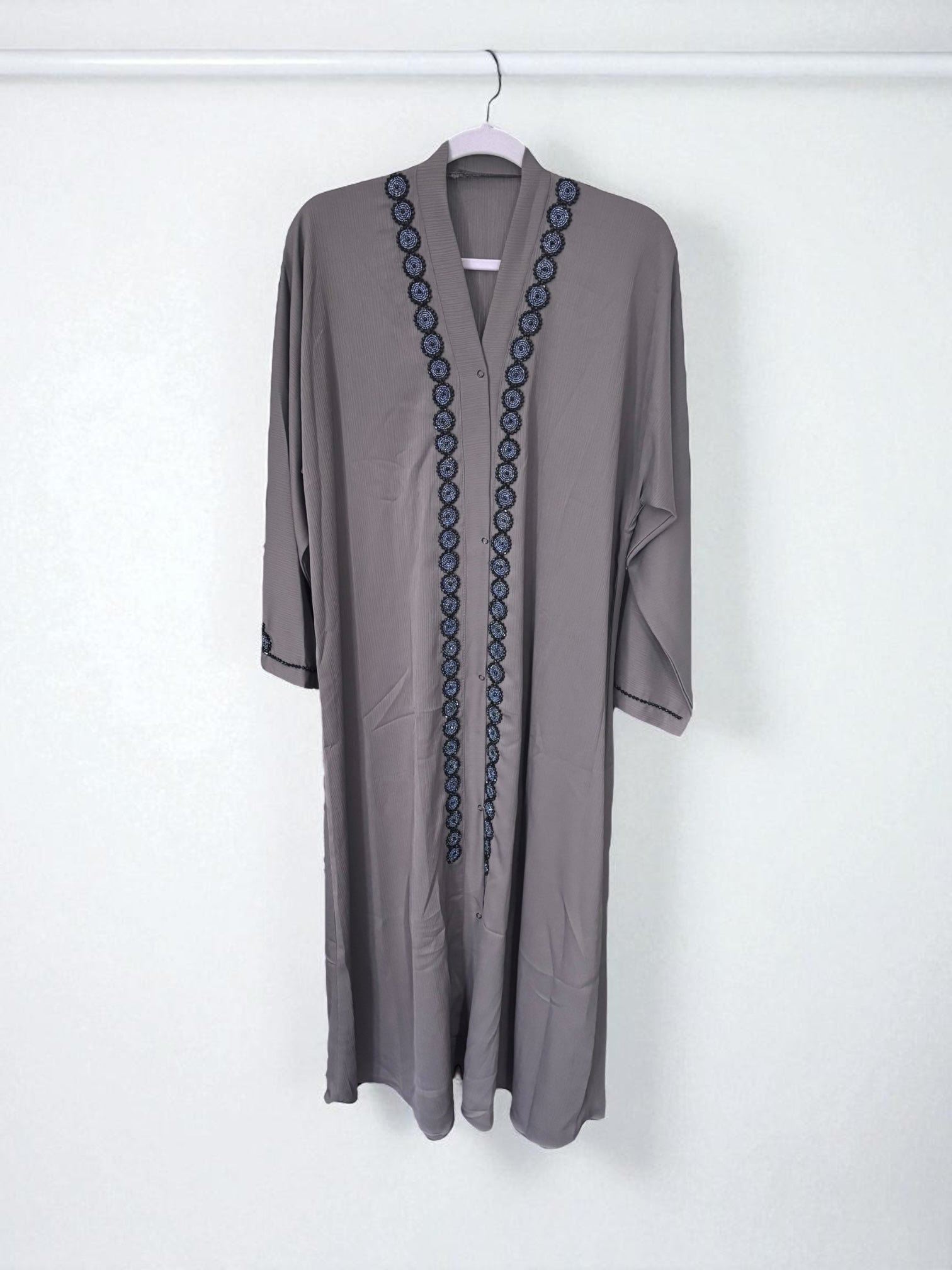 Women’s black Abaya Burqa by Saree Ghor Charlotte, modest Islamic dress with flowing fabric and elegant design, front view.