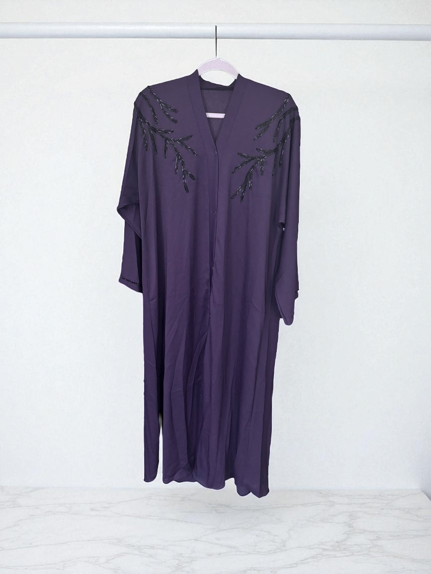 Women’s black Abaya Burqa by Saree Ghor Charlotte, modest Islamic dress with flowing fabric and elegant design.