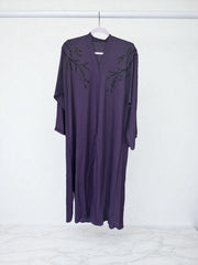 Women’s black Abaya Burqa by Saree Ghor Charlotte, modest Islamic dress with flowing fabric and elegant design.