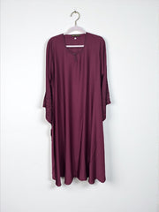 Women’s black abaya by Saree Ghor Charlotte, modest Islamic dress with flowing fabric and elegant design, front view.
