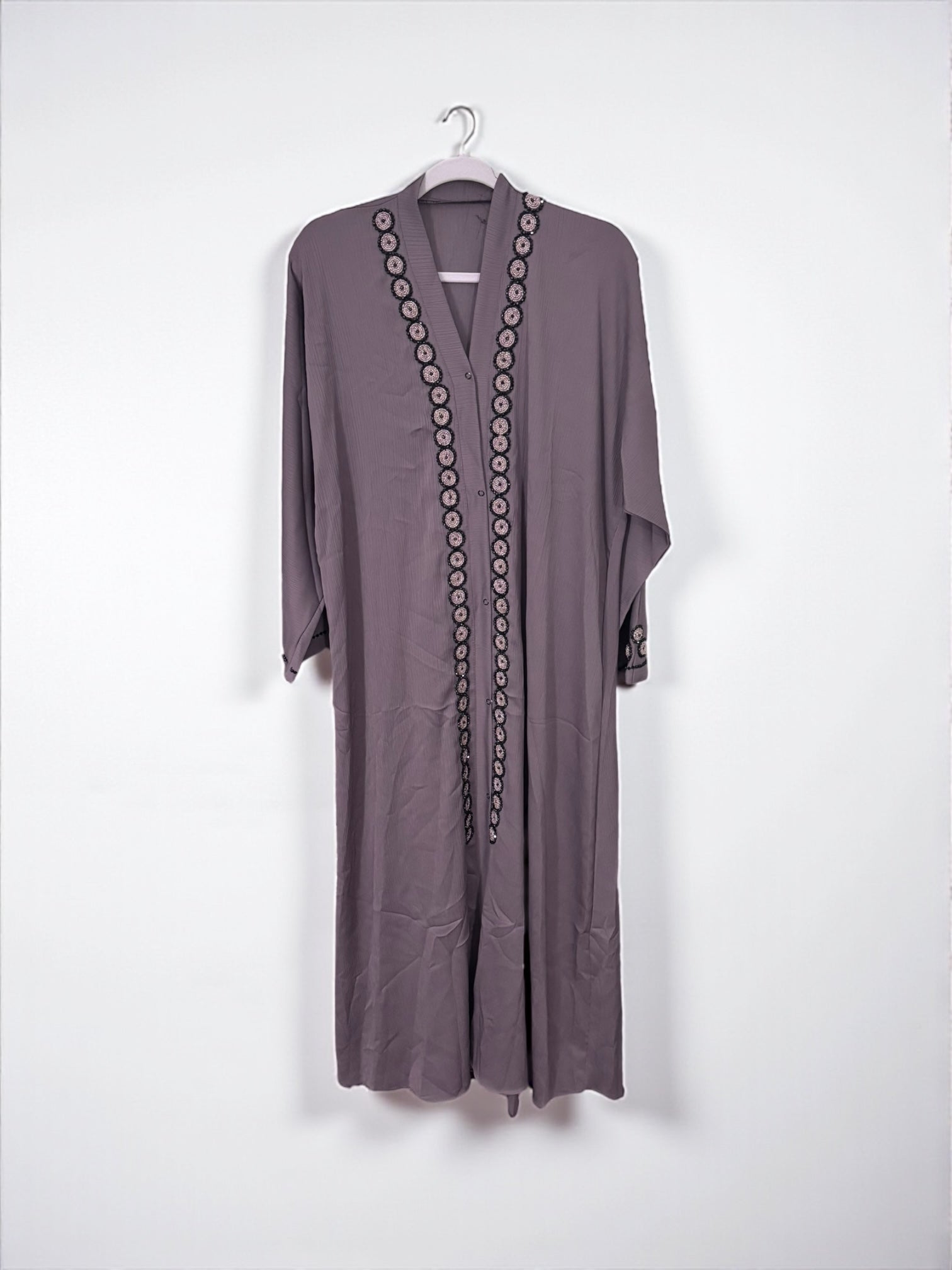 Women’s black Abaya Burqa by Saree Ghor Charlotte, modest Islamic dress with flowing fabric, full-length and elegant design.