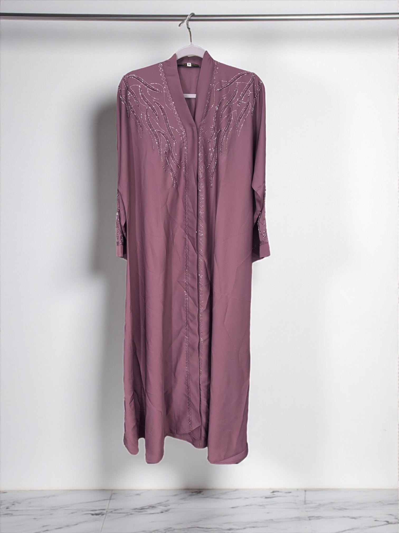 Women’s black Abaya Burqa by Saree Ghor Charlotte, modest Islamic dress with flowing fabric and elegant design.