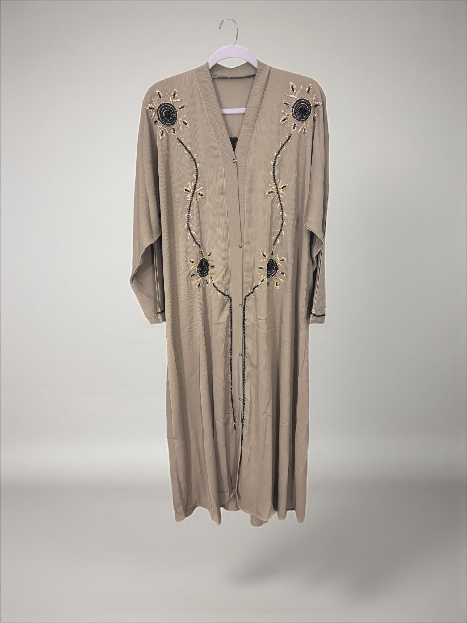 Women’s black Abaya Burqa by Saree Ghor Charlotte, modest Islamic dress with flowing fabric and full-length coverage.
