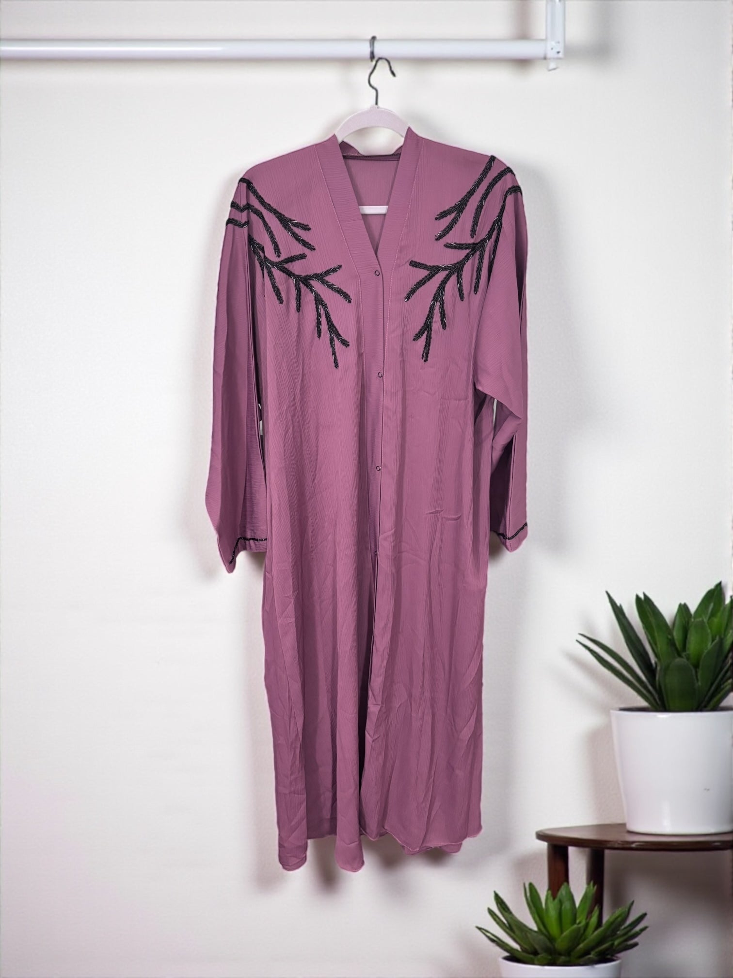 Women’s black Abaya Burqa by Saree Ghor Charlotte, modest Islamic dress with flowing fabric and elegant design.