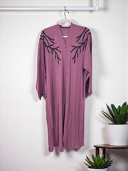 Women’s black Abaya Burqa by Saree Ghor Charlotte, modest Islamic dress with flowing fabric and elegant design.