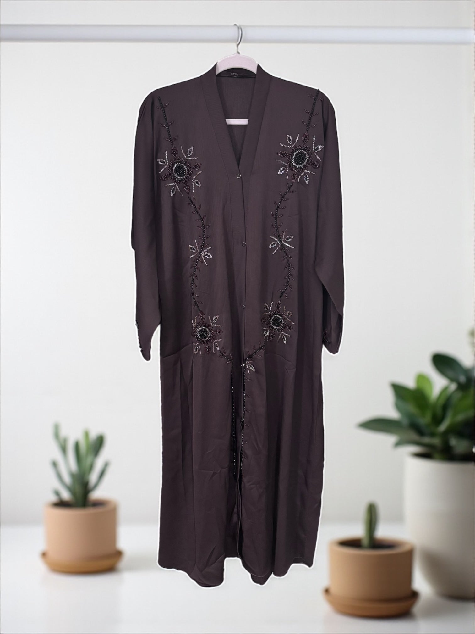 Women’s black abaya and burqa by Saree Ghor Charlotte, modest Islamic dress with flowing fabric and elegant design.