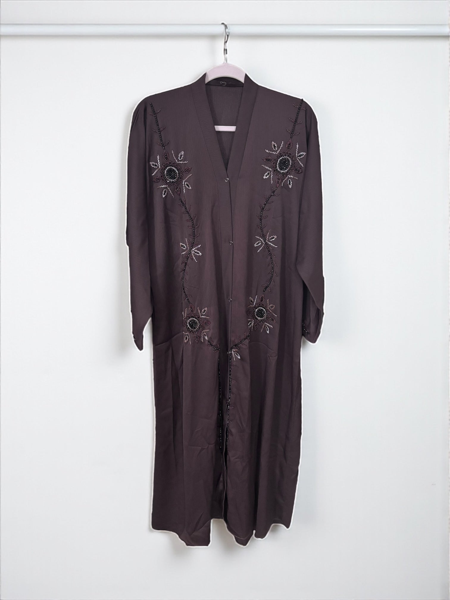 Women’s black abaya burqa by Saree Ghor Charlotte, modest Islamic dress with flowing fabric and elegant design.