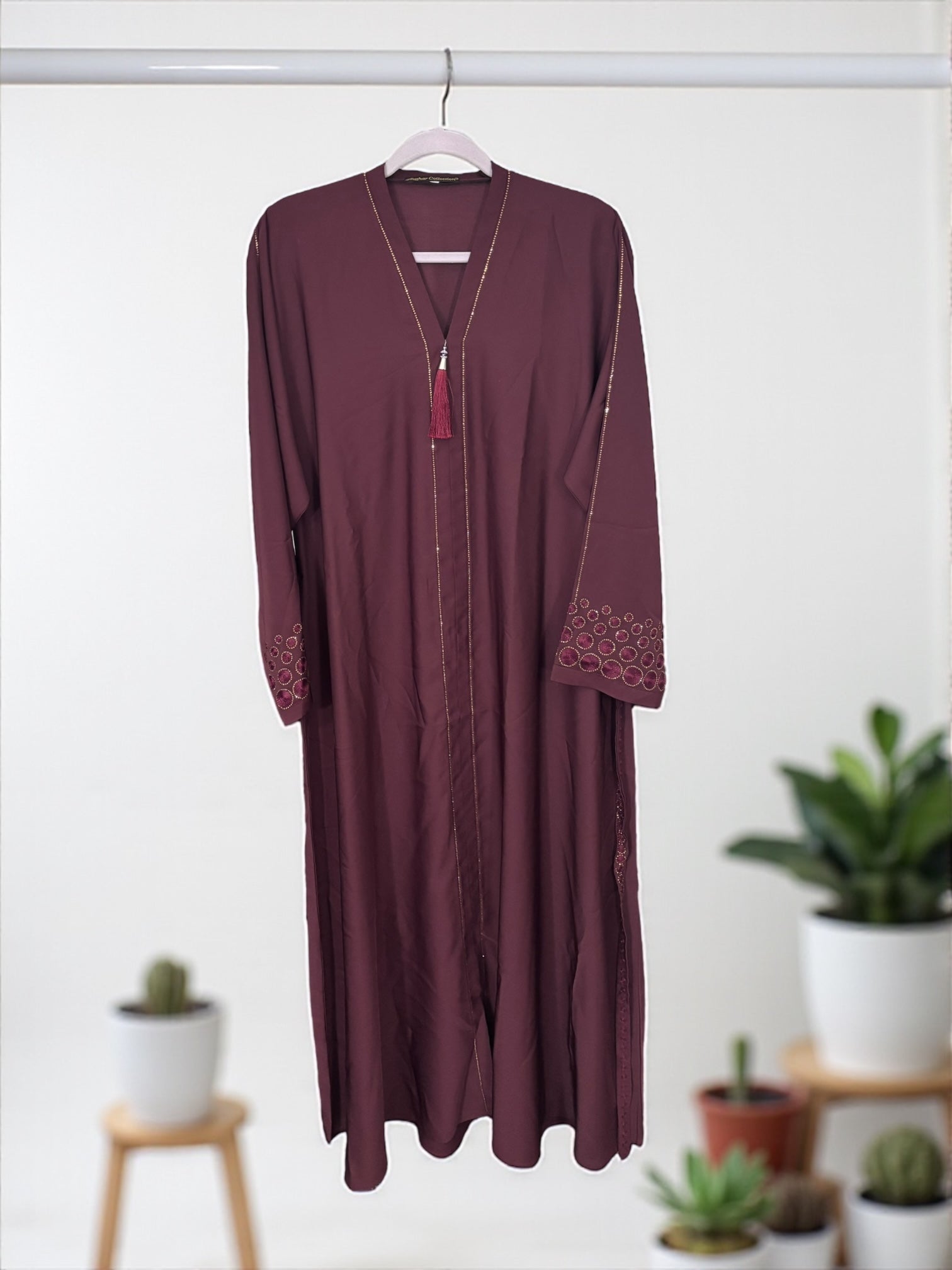 Women’s black Abaya Burqa by Saree Ghor Charlotte, modest Islamic dress with flowing fabric and elegant design.