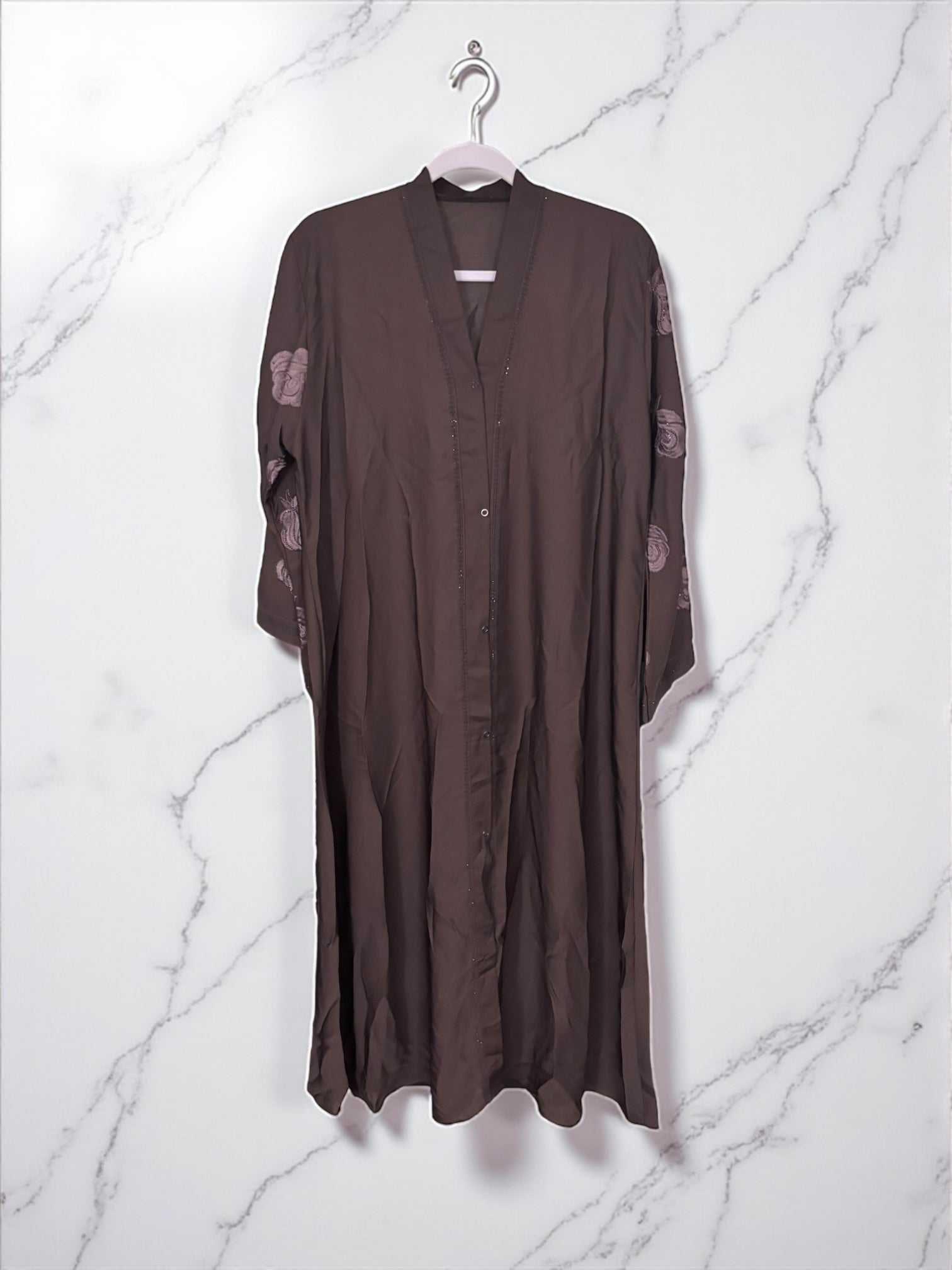Women’s black abaya burqa, modest Islamic dress by Saree Ghor Charlotte, shown with flowing fabric and full-length coverage.
