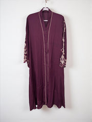 Women’s black Abaya Burqa by Saree Ghor Charlotte, modest Islamic dress with flowing fabric and full coverage.