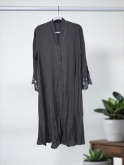 Women’s black Abaya Burqa by Saree Ghor Charlotte, modest Islamic dress with full-length coverage, lightweight and elegant fabric.