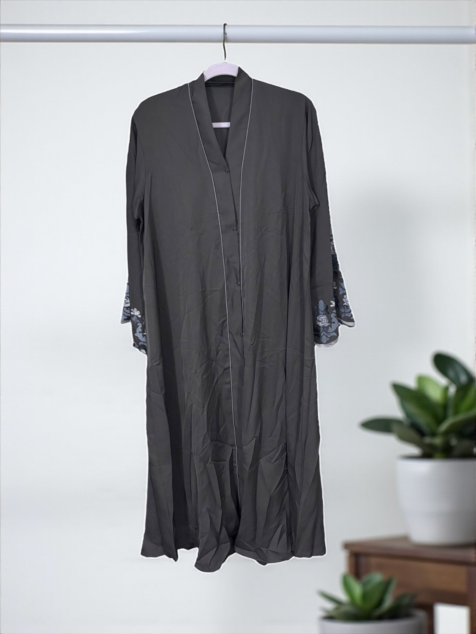 Women’s black Abaya Burqa by Saree Ghor Charlotte, modest Islamic dress with full-length coverage, lightweight and elegant fabric.