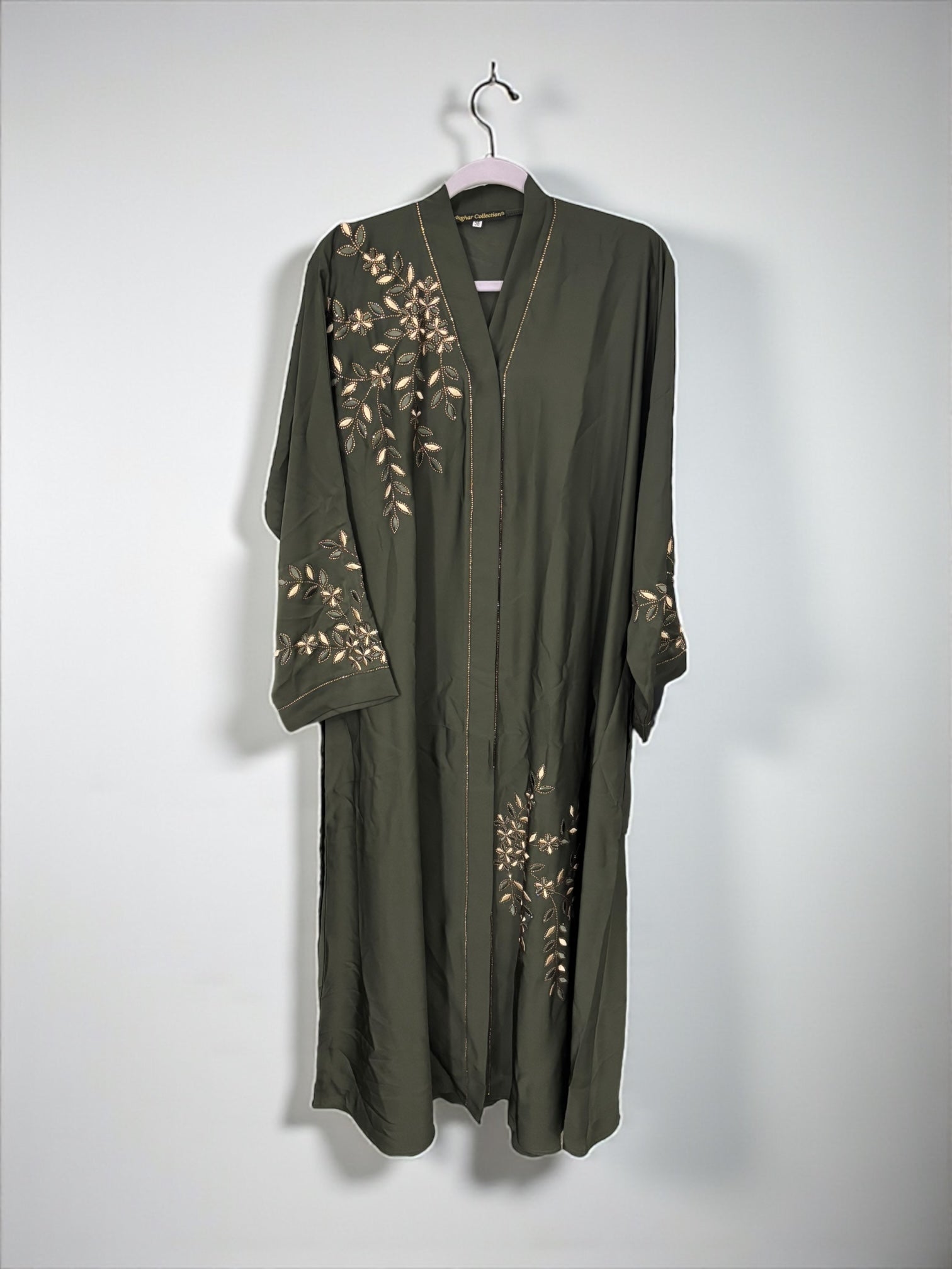 Women’s black abaya burqa by Saree Ghor Charlotte, modest Islamic dress with flowing fabric and elegant design, front view.