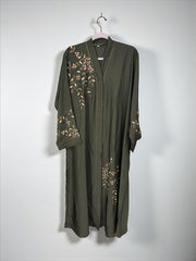 Women’s black abaya burqa by Saree Ghor Charlotte, modest Islamic dress with flowing fabric and elegant design, front view.