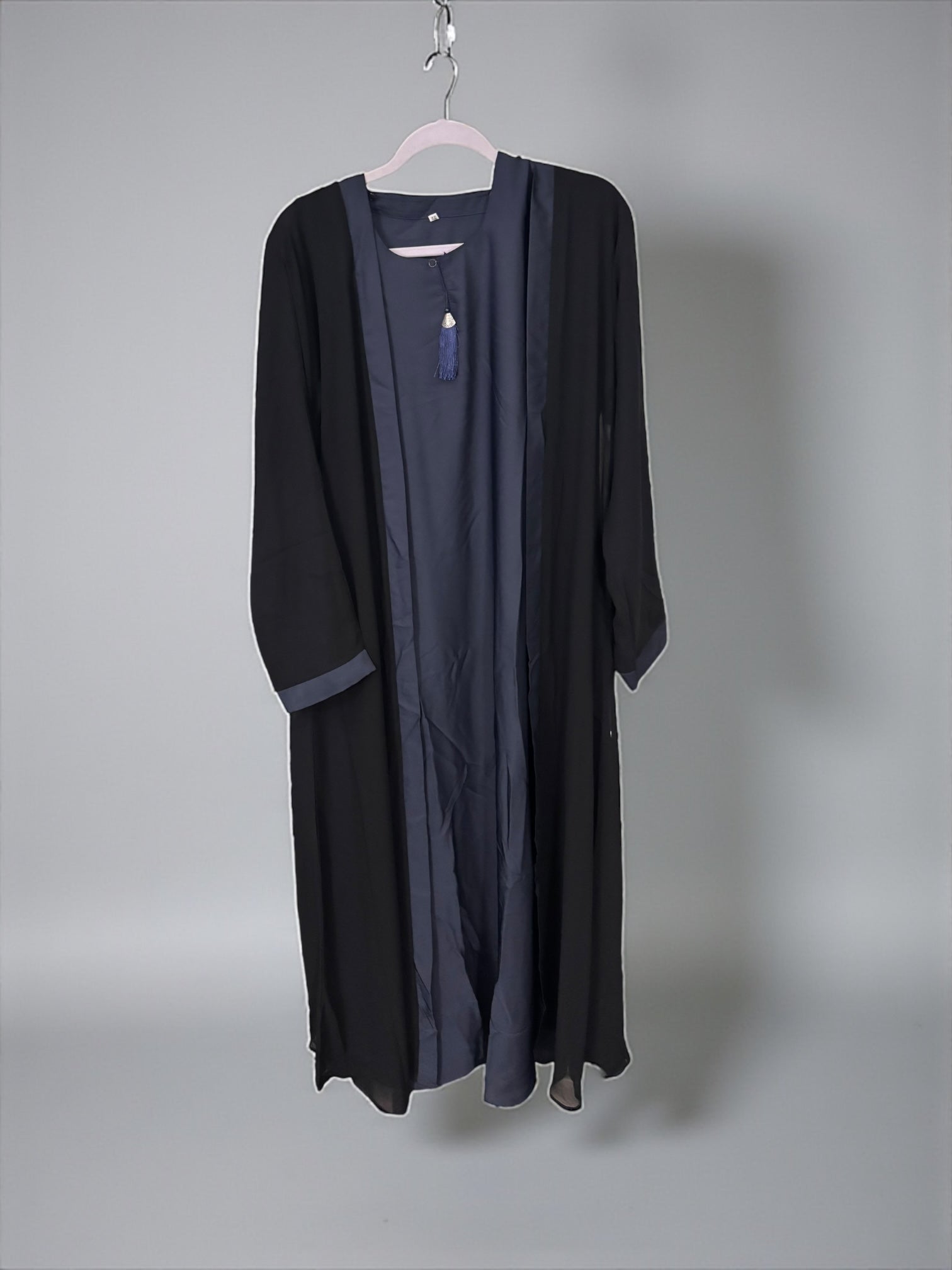 Women’s black Abaya Burqa by Saree Ghor Charlotte, modest Islamic dress with intricate embroidery and flowing fabric.