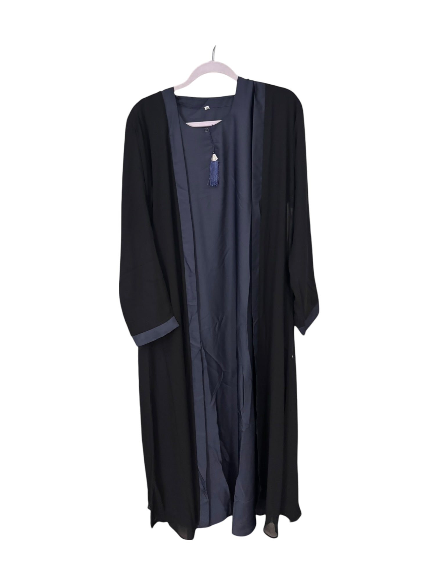 Women’s black abaya burqa by Saree Ghor Charlotte, modest Islamic dress featuring flowing fabric and full-body coverage.