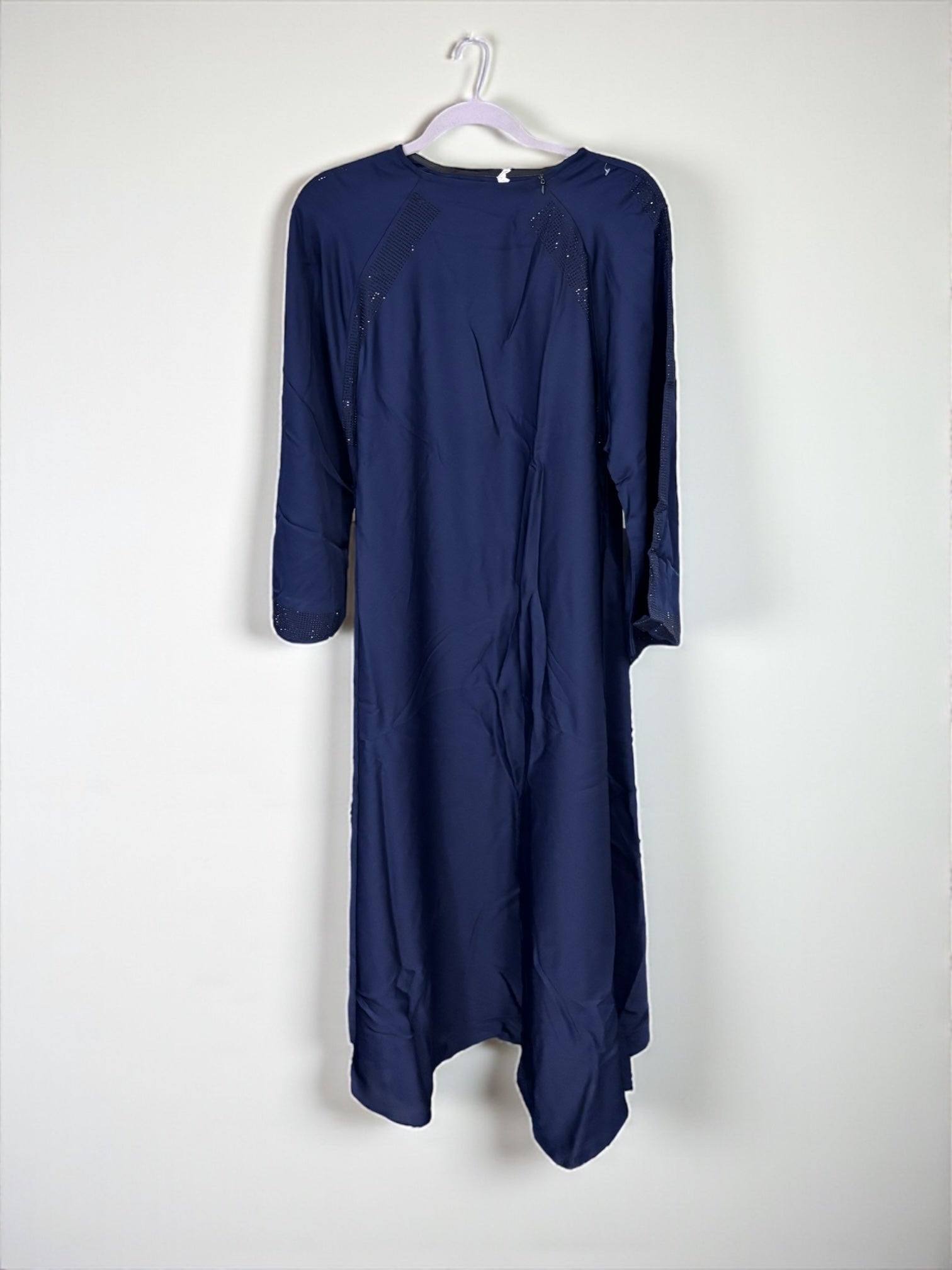 Women’s black Abaya burqa by Saree Ghor Charlotte, modest Islamic dress with flowing fabric and elegant design.