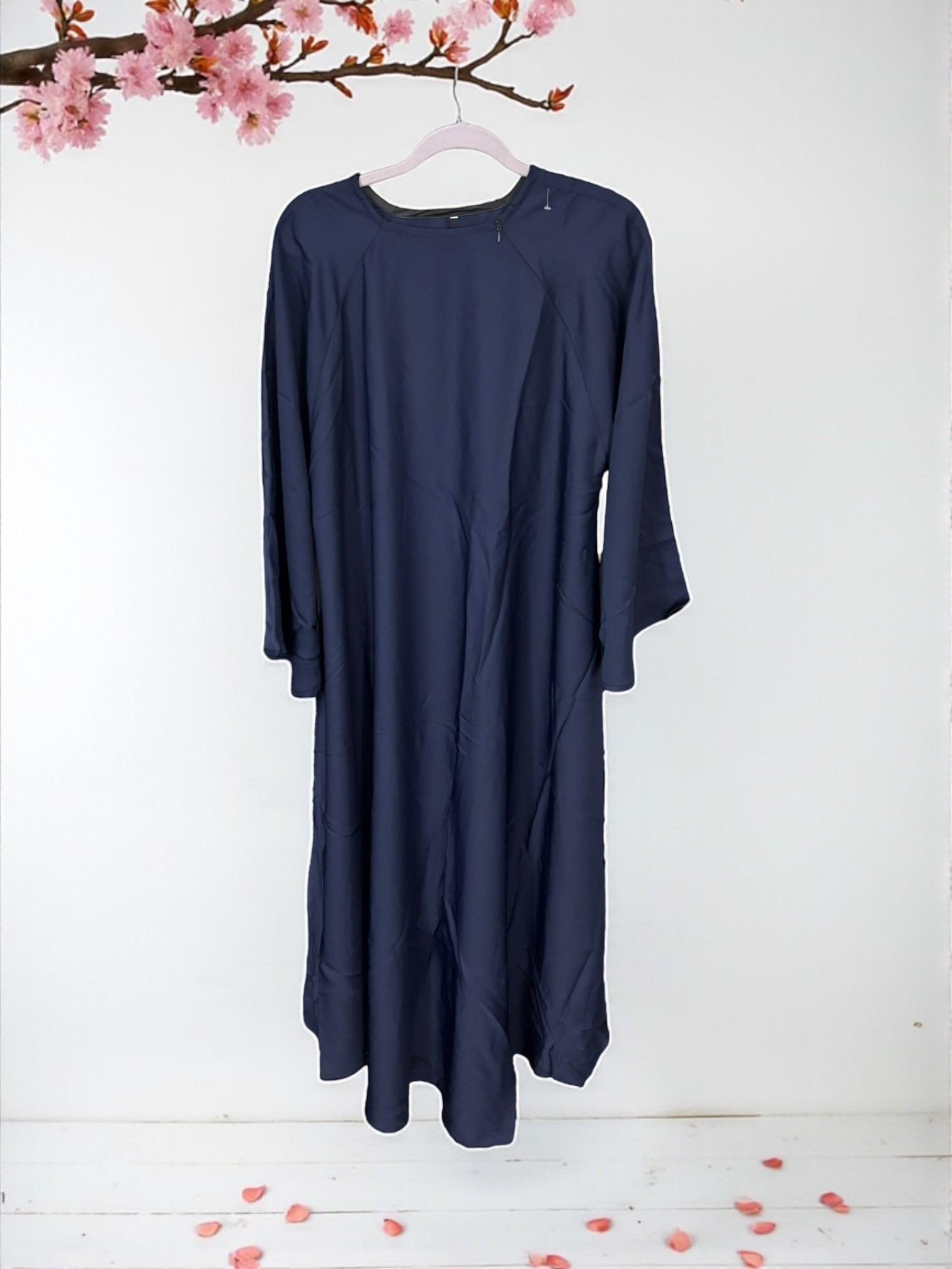 Women’s black Abaya Burqa by Saree Ghor Charlotte, modest Islamic dress with flowing fabric and elegant design, front view.