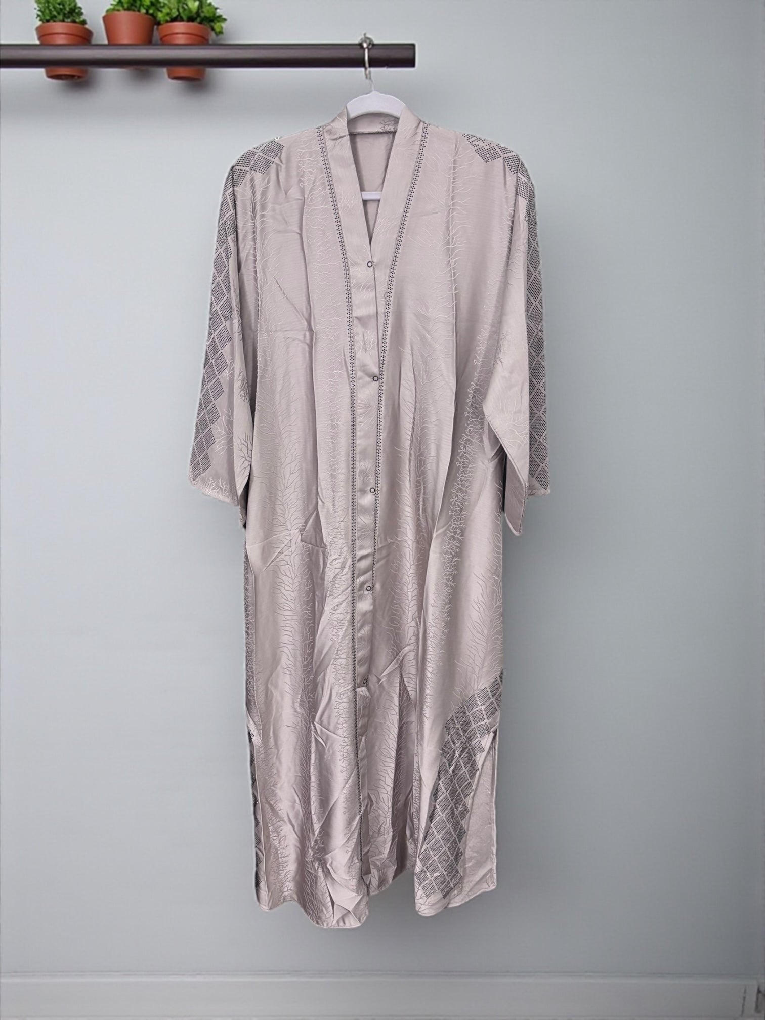 Women’s black Abaya Burqa by Saree Ghor Charlotte, modest Islamic dress with flowing fabric and traditional design.