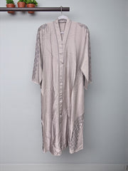 Women’s black Abaya Burqa by Saree Ghor Charlotte, modest Islamic dress with flowing fabric and traditional design.