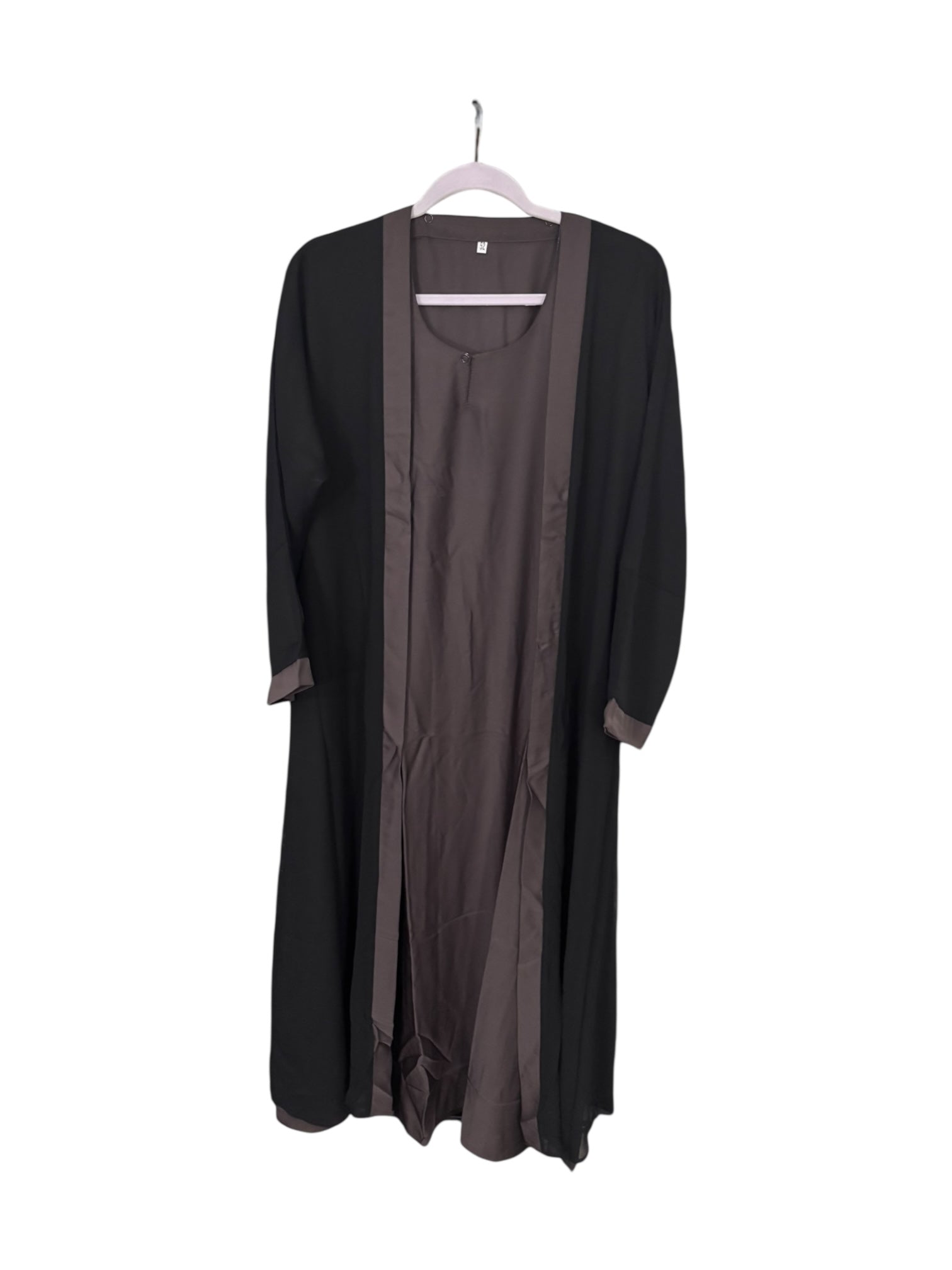 Women’s black Abaya from Saree Ghor Charlotte, modest Islamic dress with flowing fabric and elegant design.