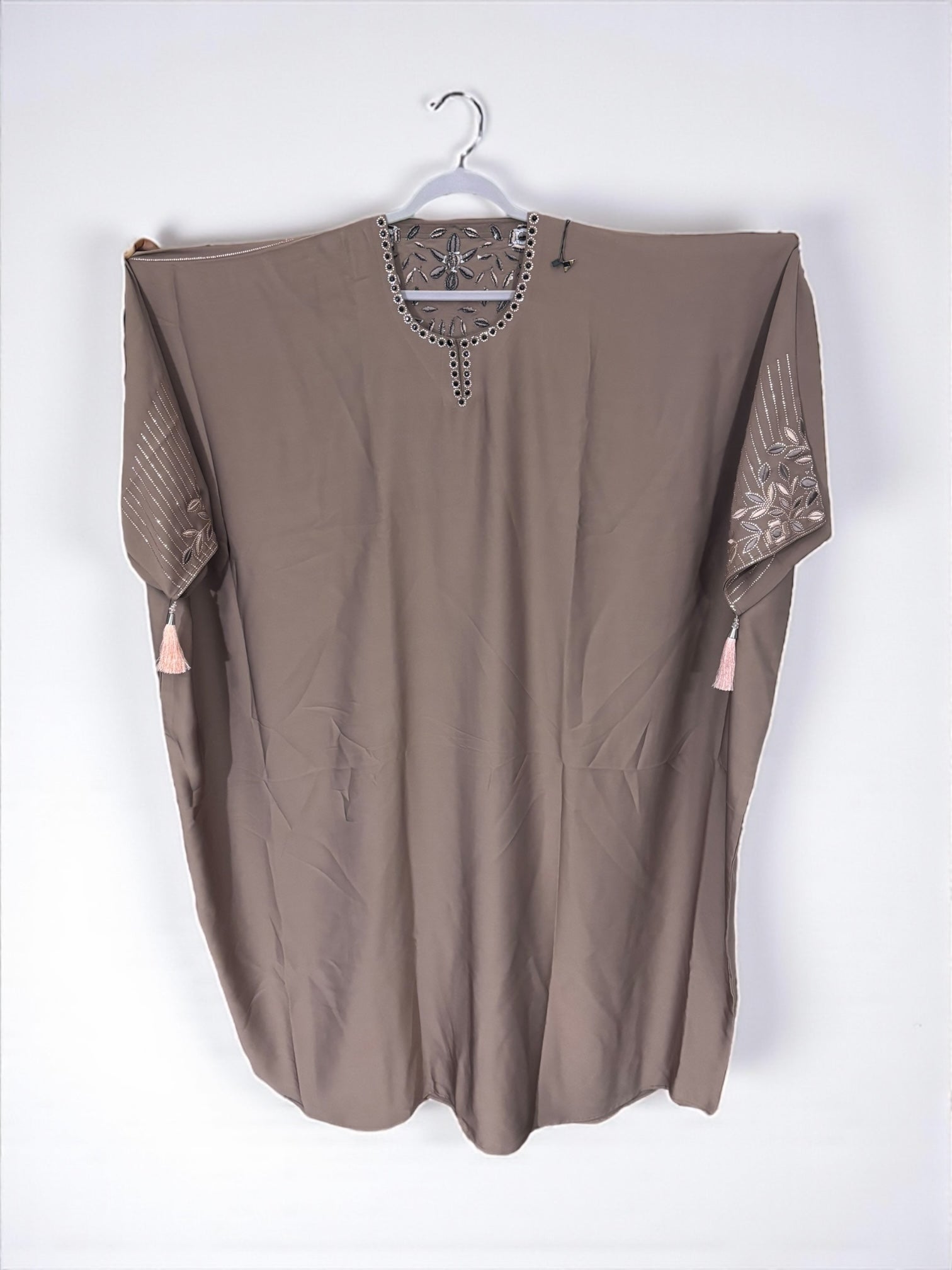 Women’s black kaftan abaya by Saree Ghor Charlotte, modest Islamic dress with flowing fabric and intricate embroidery, front view.