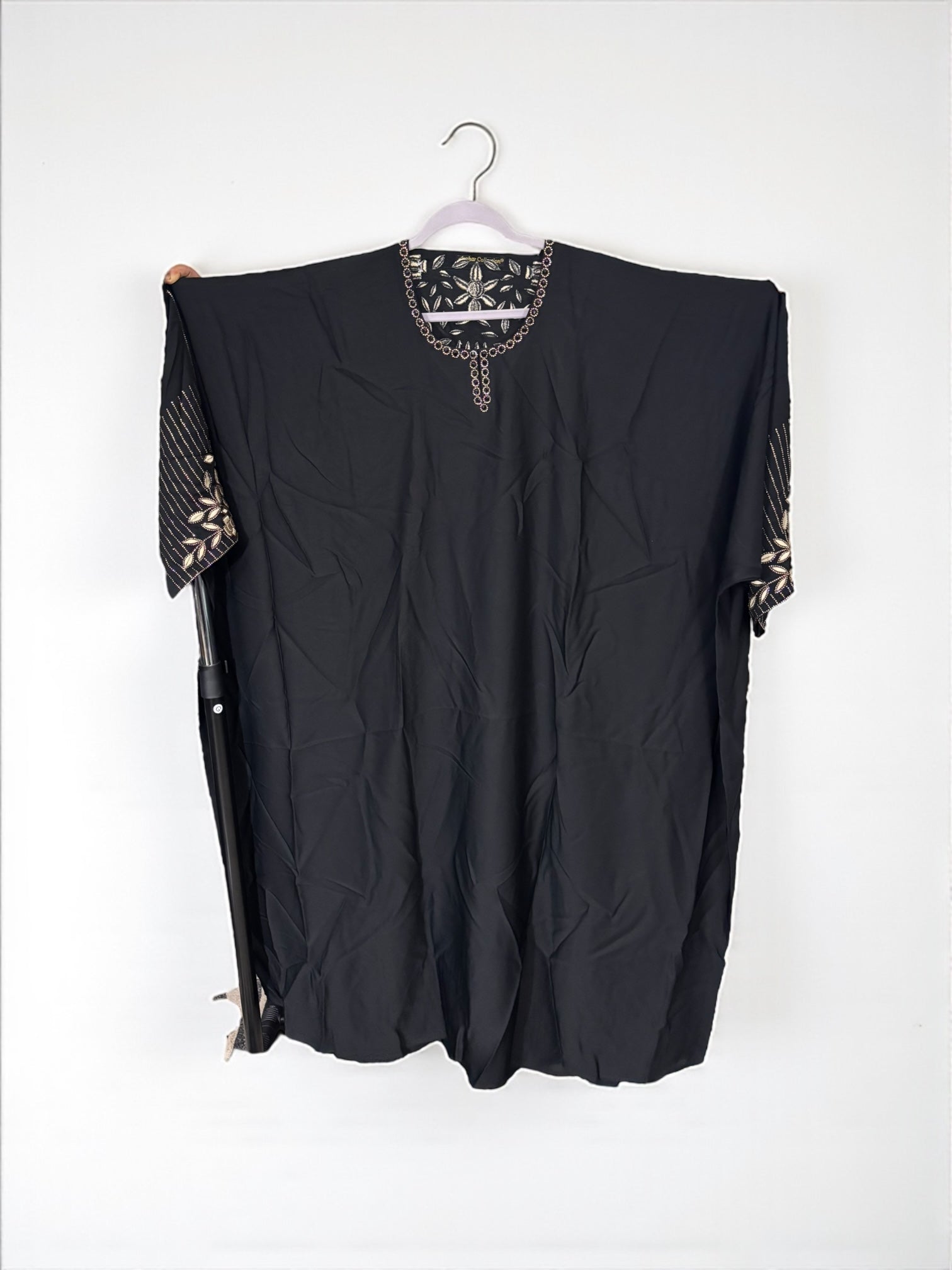Women’s black kaftan abaya by Saree Ghor Charlotte featuring modest Islamic style, flowing fabric and elegant design.