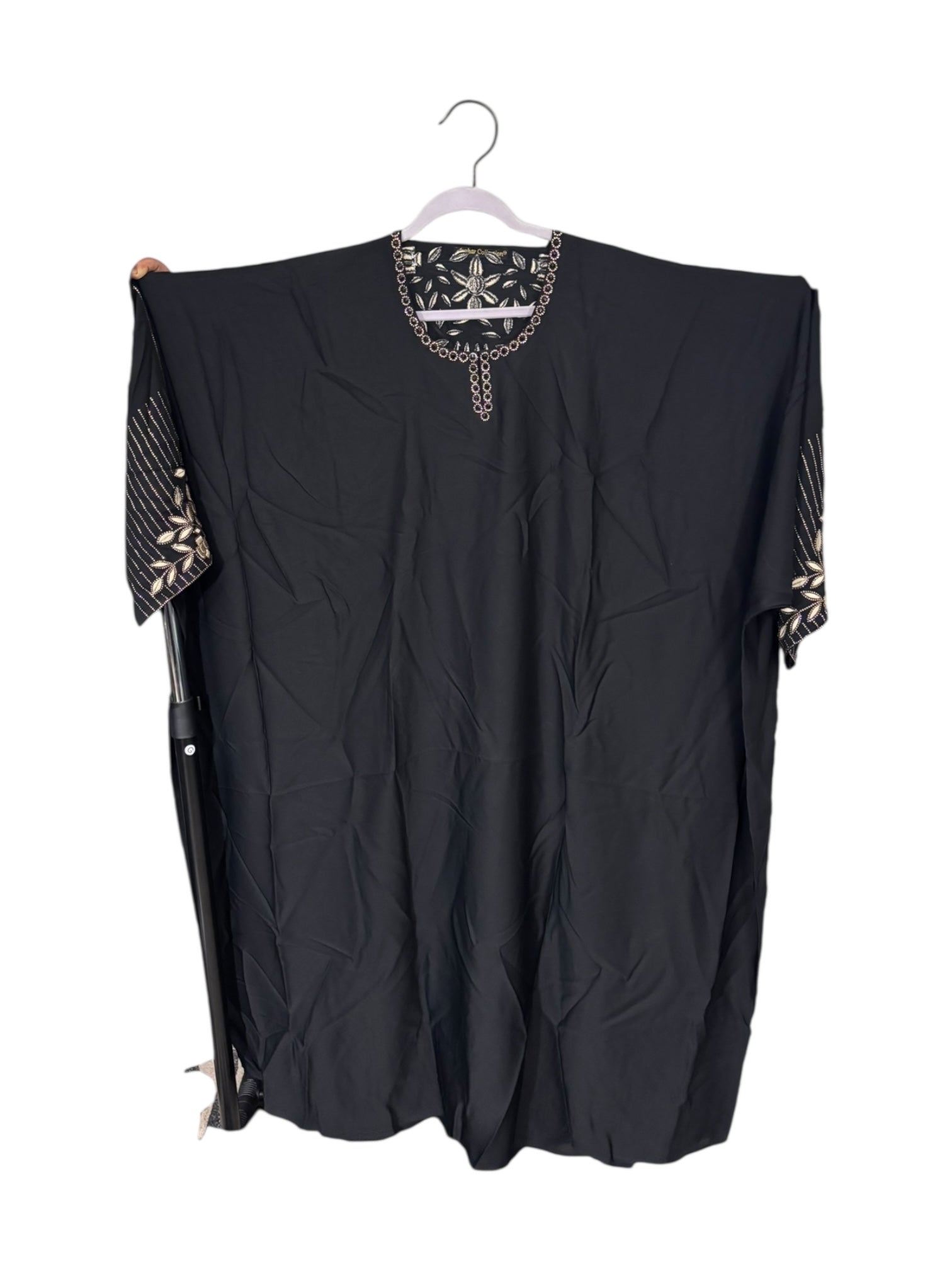Women’s Saree Ghor Charlotte kaftan abaya, modest Islamic dress in flowing fabric, featuring intricate embroidery and elegant design.