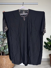Women’s black kaftan abaya by Saree Ghor Charlotte featuring modest Islamic dress with flowing fabric and intricate embroidery details.