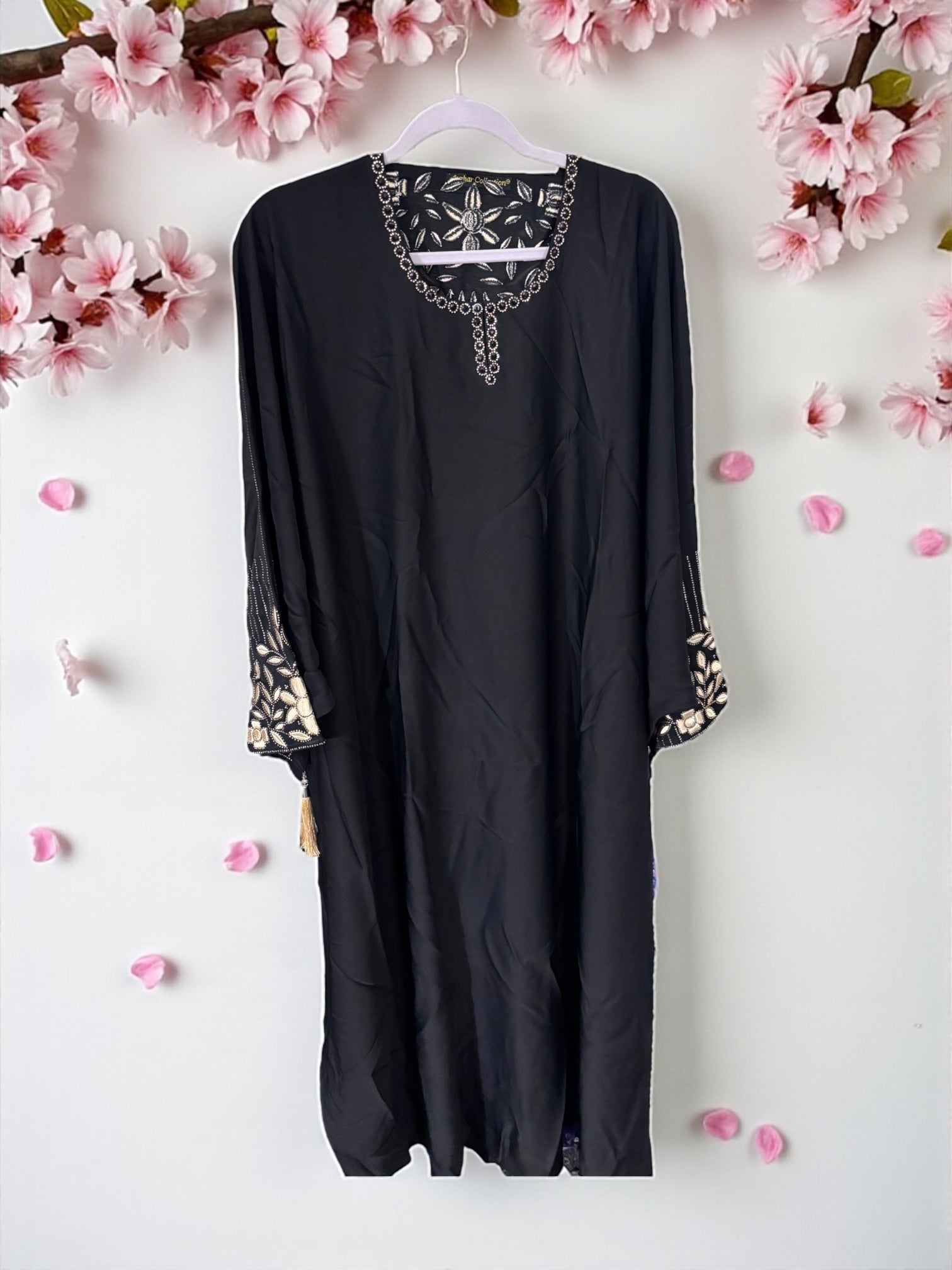 Women’s Saree Ghor Charlotte abaya, modest Islamic dress with flowing fabric, detailed embroidery, and elegant design.