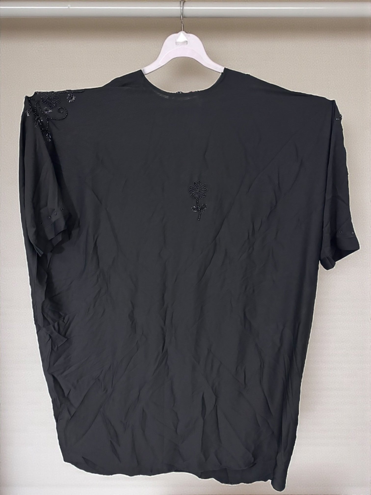 Women’s black kaftan abaya by Saree Ghor Charlotte, modest Islamic dress with flowing fabric and elegant design.