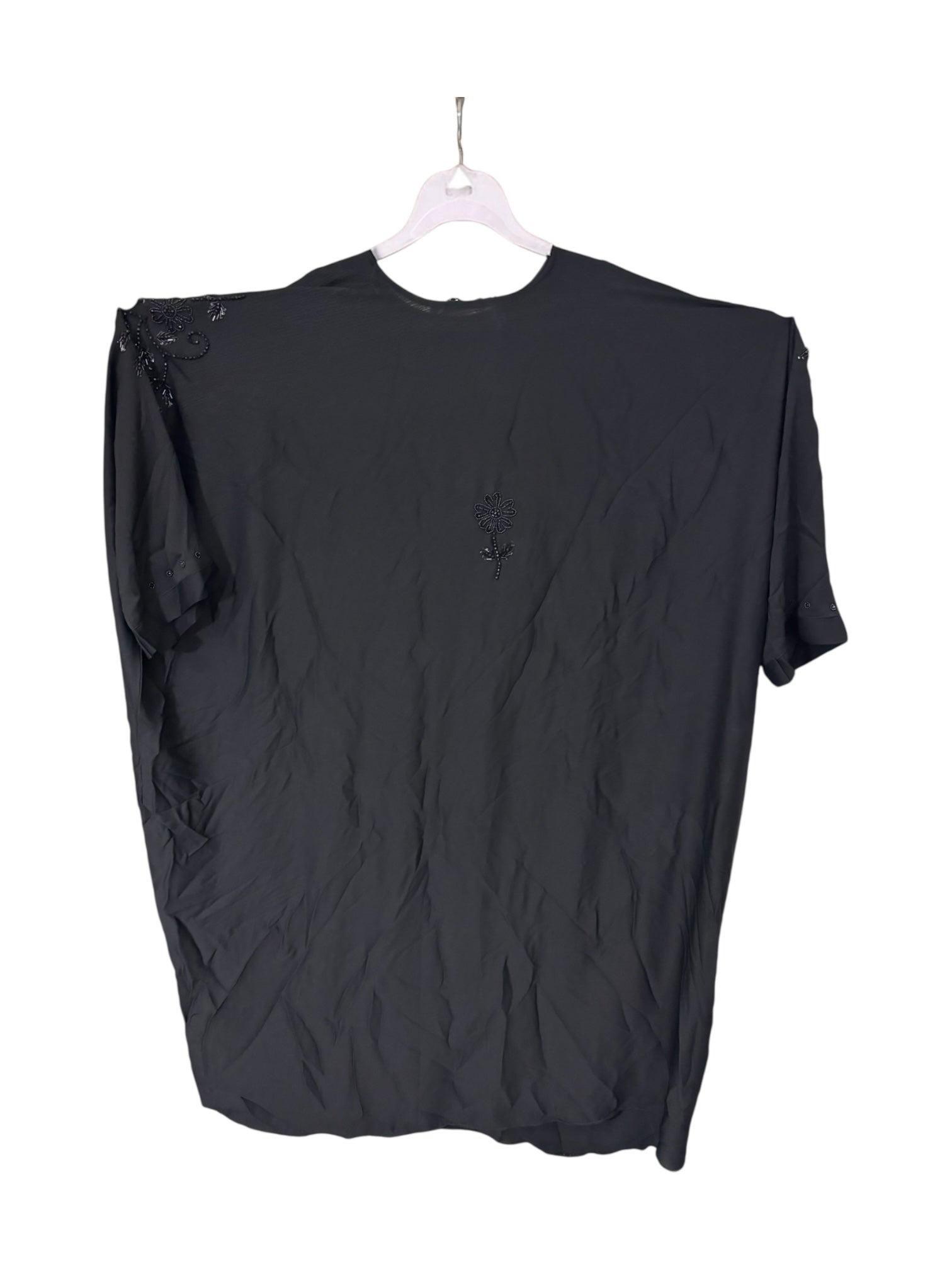 Women’s black kaftan abaya by Saree Ghor Charlotte, modest Islamic dress with flowing fabric and elegant design.