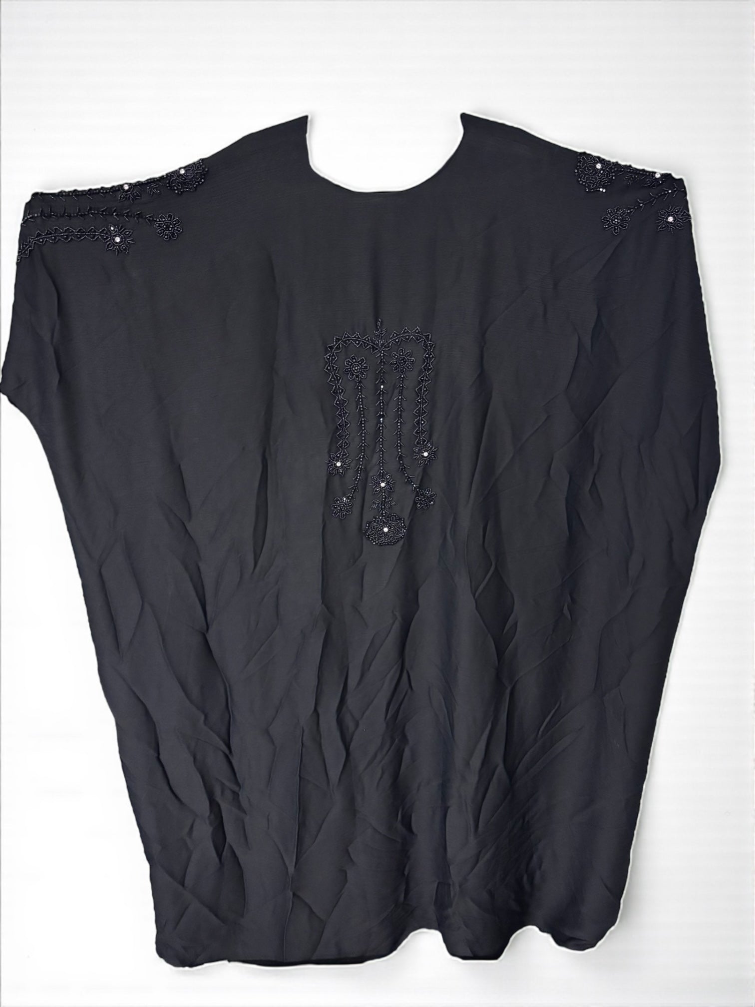 Women’s black Saree Ghor Charlotte abaya with intricate embroidery, modest Islamic dress, flowing kaftan style, full-length fabric.