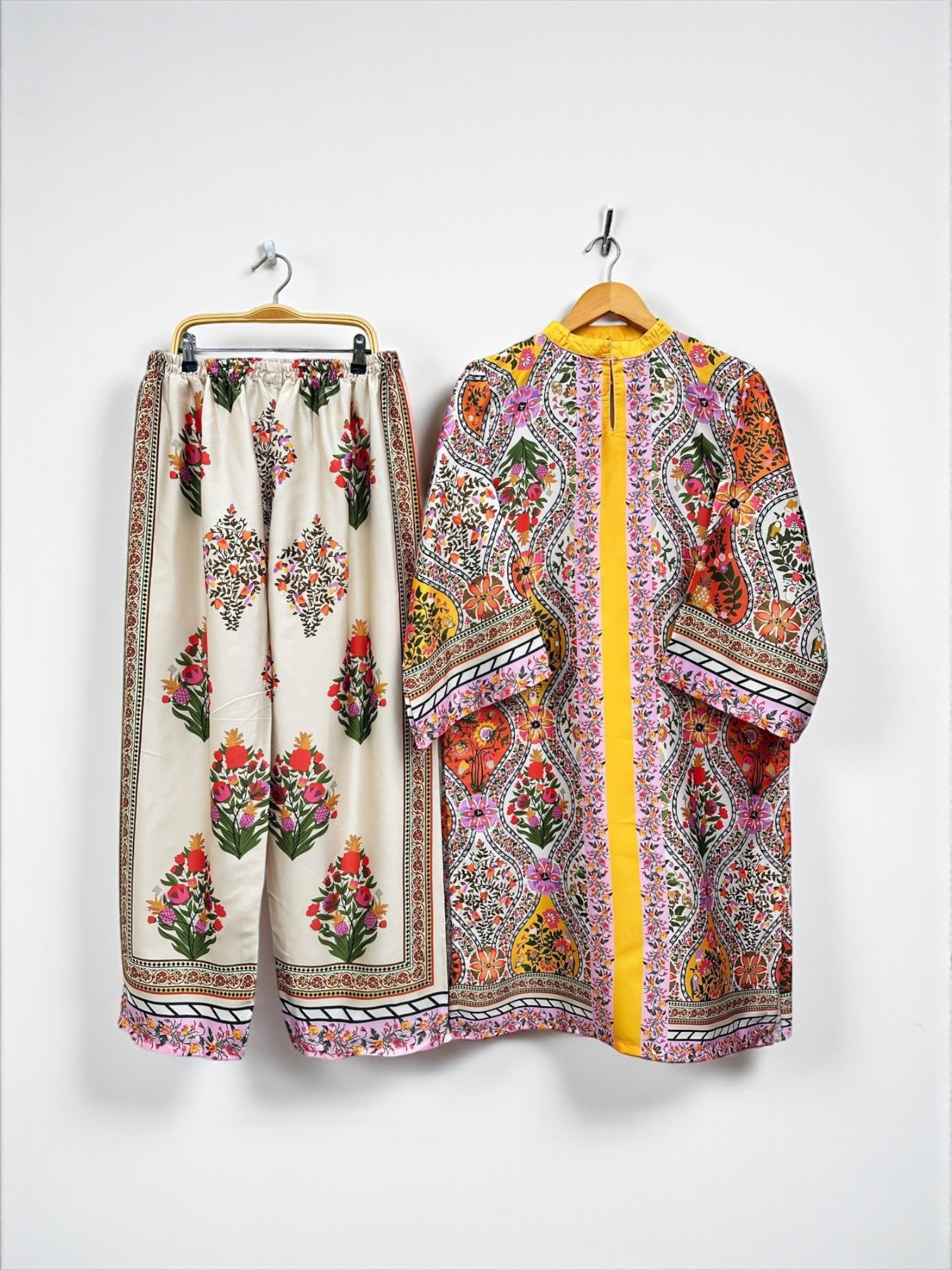 Traditional two-piece kurti set for women, featuring colorful salwar kameez from Saree Ghor Charlotte, suitable for cultural wear.
