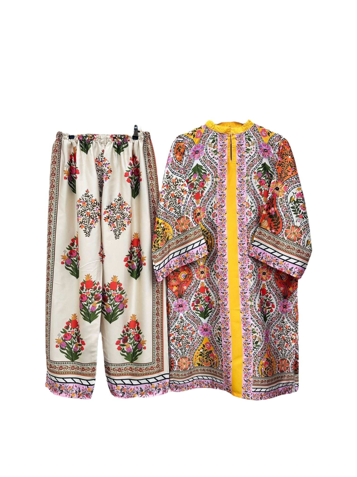 Traditional two-piece Kurti set from Saree Ghor Charlotte, featuring vibrant kurta and salwar for women's cultural wear.