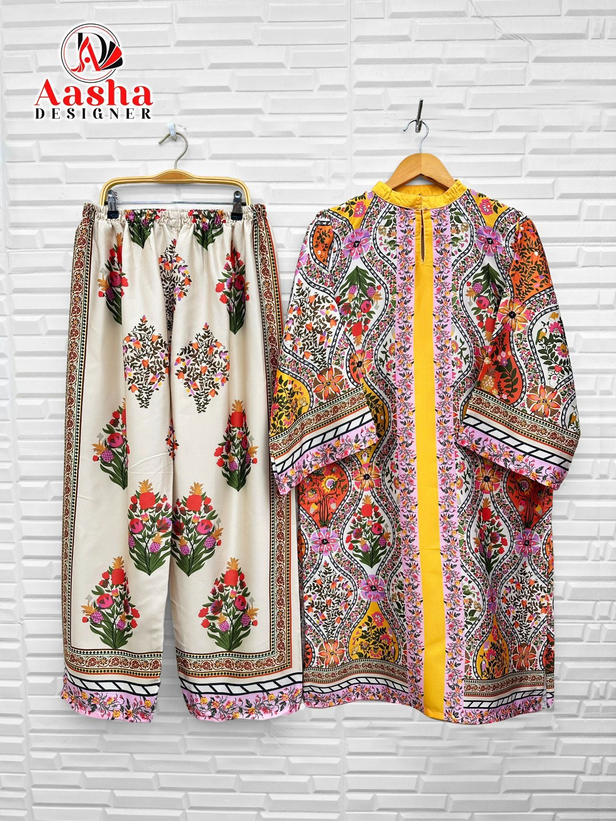 Traditional two-piece kurti set for women, Saree Ghor Charlotte salwar kameez with intricate embroidery and vibrant colors.