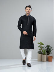Black men's traditional kurta and pajama set by Saree Ghor Charlotte, showcasing cultural men's wear with intricate design details.